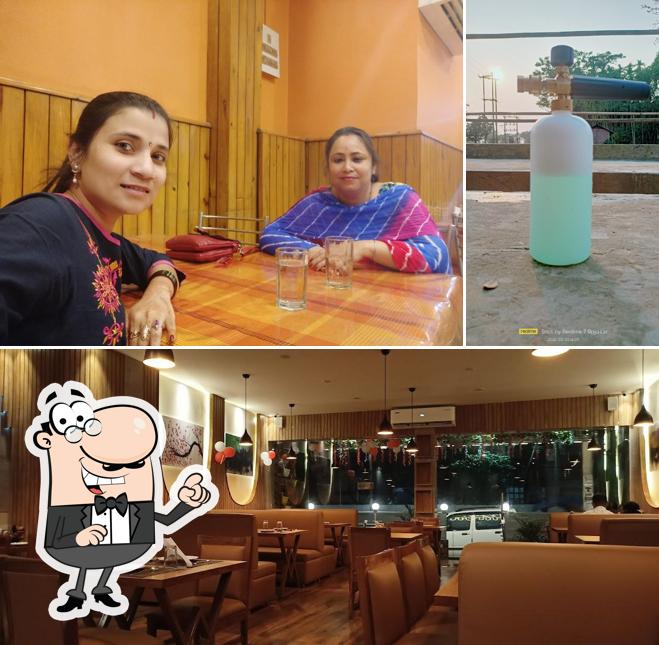 This is the picture showing interior and beverage at Gandharb Restaurant
