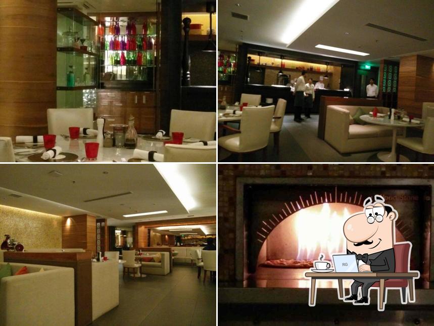 Take a seat at one of the tables at Bella - Crown Plaza
