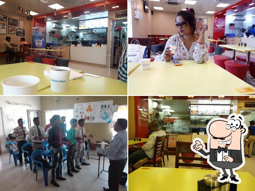 Take a seat at one of the tables at Domino's Pizza Parvathi Nagar, Bellary