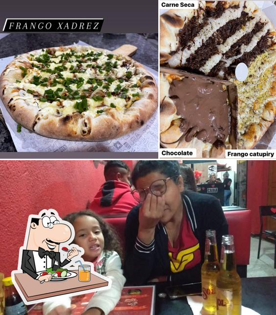 Entre diversos coisas, comida e interior podem ser encontrados no Pizzaria D'GUST