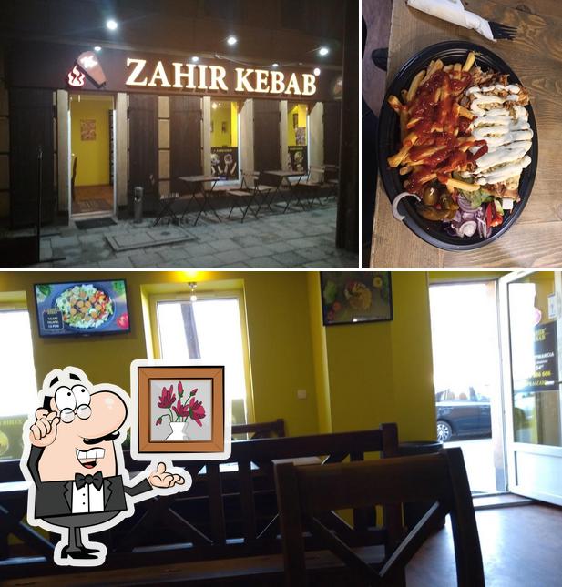 Among different things one can find interior and food at Zahir Kebab