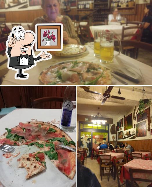 Dai un'occhiata agli interni di far west pizzeria ristorante