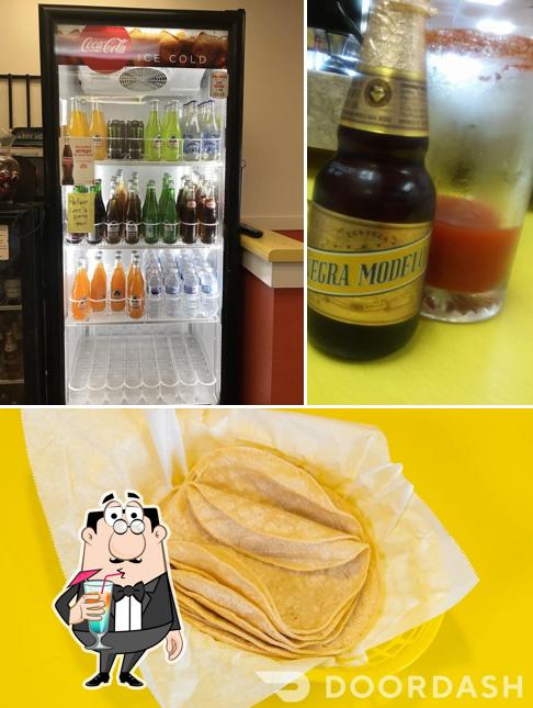 Take a look at the picture showing drink and food at Carnitas La Piedad Restaurant