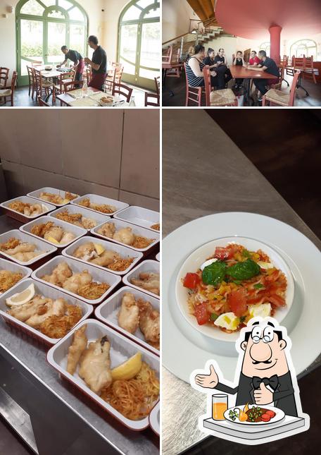 La foto di cibo e interni da Ristorante - Pizzeria "Le mani in pasta"