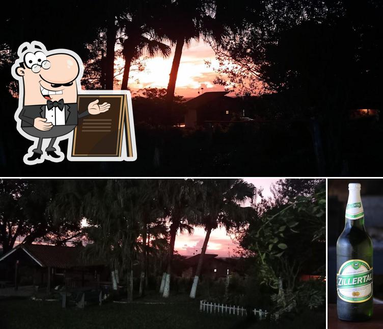 Entre diferentes coisas, exterior e cerveja podem ser encontrados no Recanto das Seriemas - Restaurante, churrascaria estilo Argentino e Pousada com vista para as montanhas