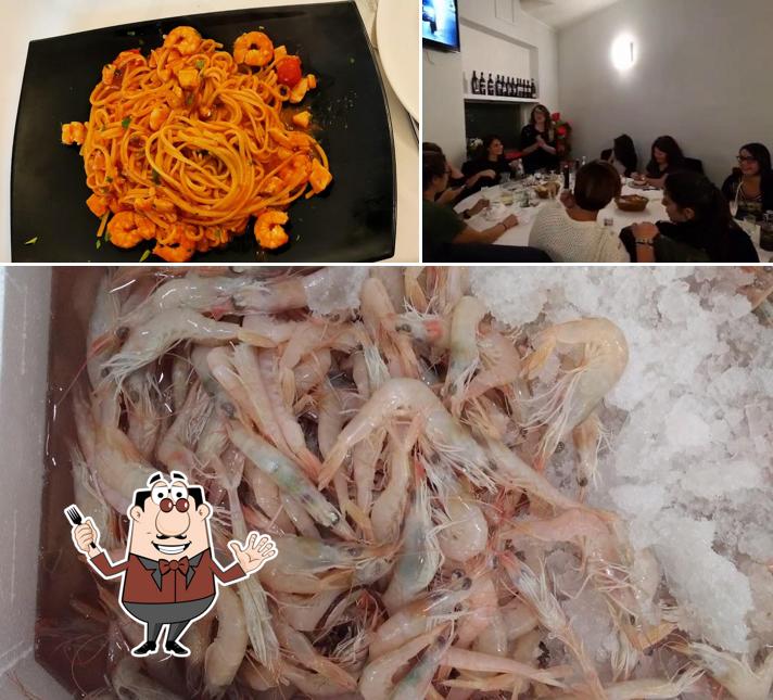 Guarda la immagine che mostra la cibo e tavolo da pranzo di Ristorante Pizzeria La Nuova Forchetta