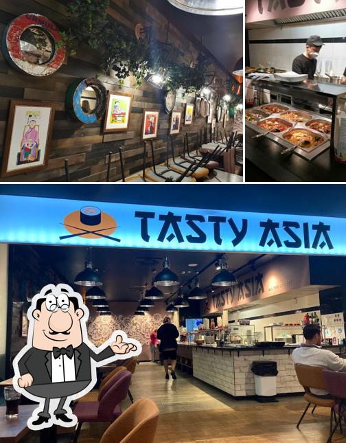 Take a look at the image showing interior and food at Tasty Asia China-Restaurant Asia