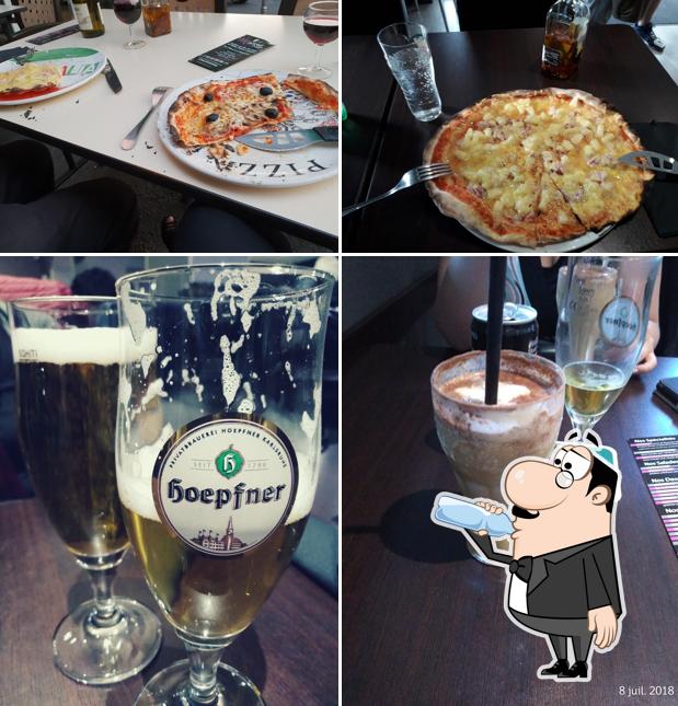 This is the image depicting drink and food at Mistral Pizza