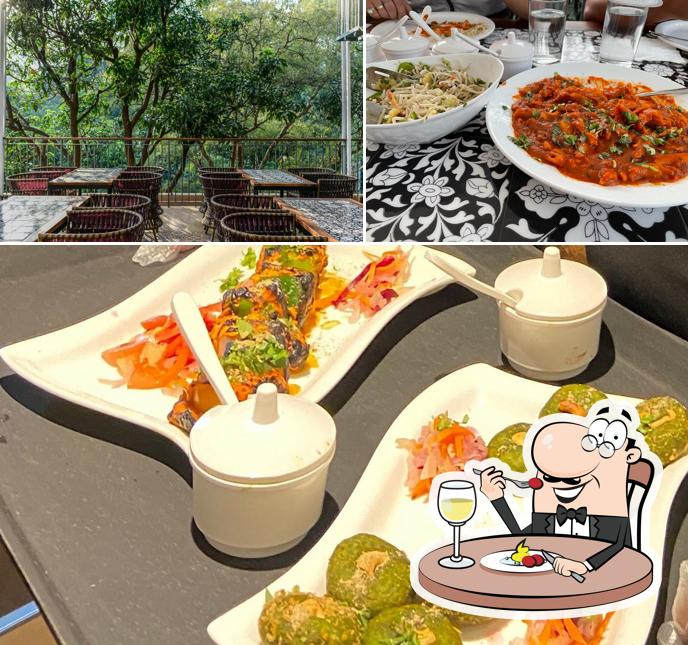 The photo of Machan - Rooftop Restaurant & Cafe in Pachmarhi’s food and exterior