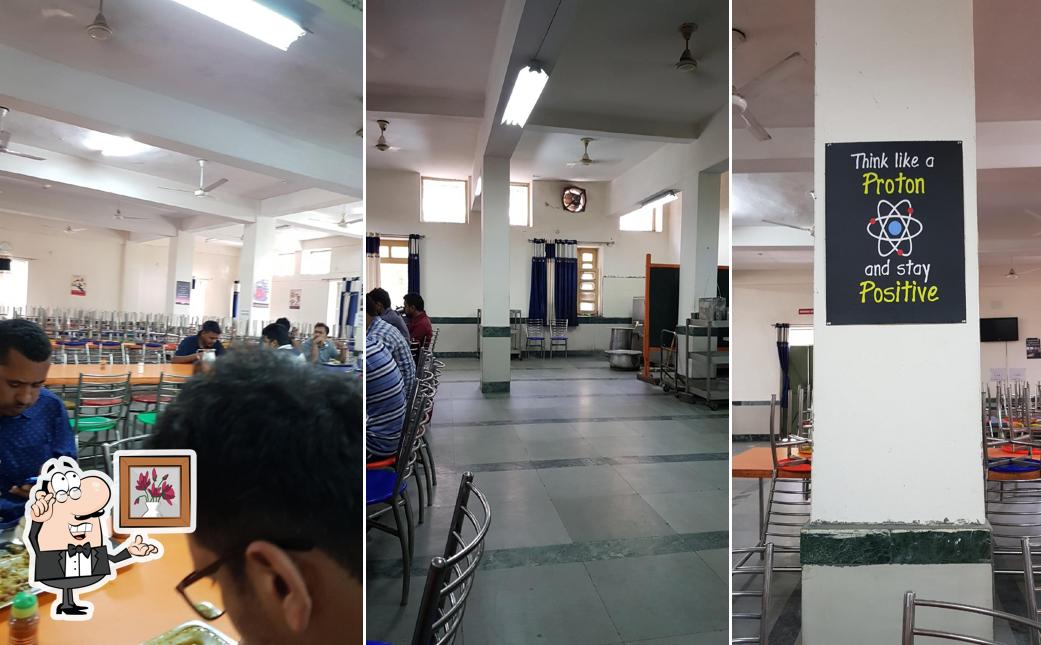 Take a seat at one of the tables at Ganga Bhawan Mess