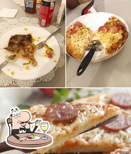 Comida em Pizzaria Primos