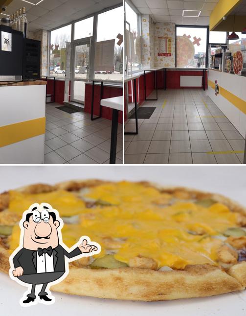 Jetez un coup d’oeil à l’image affichant la intérieur et nourriture concernant Піцерія IQ Pizza