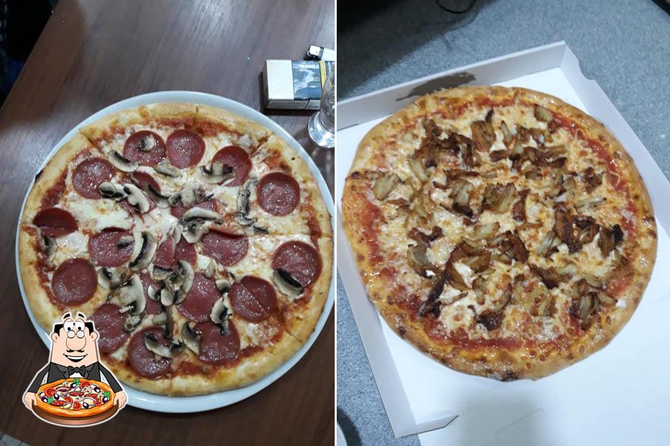 Prenez des pizzas à Pizzeria roma