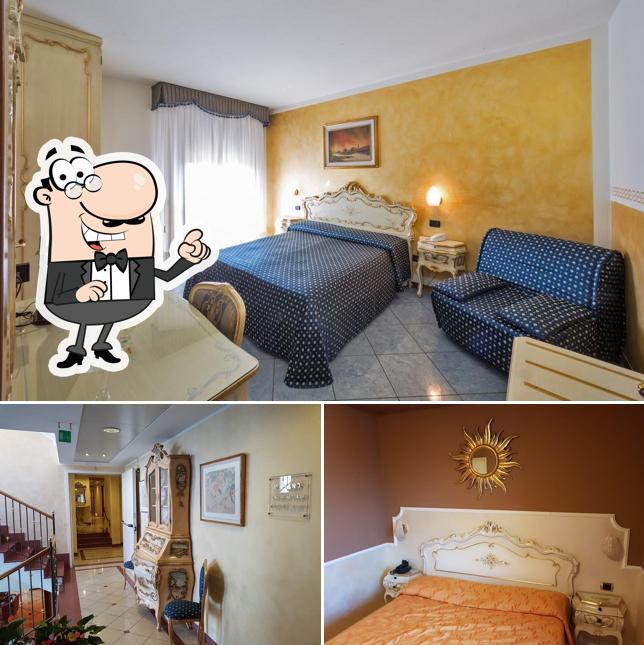 Siediti a un tavolo di Hotel Trattoria Confine