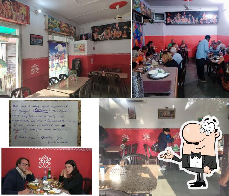 Take a seat at one of the tables at GANGOUR RESTAURANT -RAJASTHANI Punjabi Gujrati Food Maharashtrian Food Delivery in Train