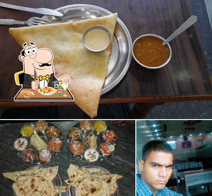 Among various things one can find food and bar counter at Bhandari Restaurant