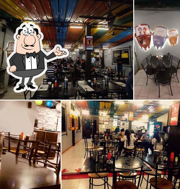 Take a seat at one of the tables at Kapoor's Cafe
