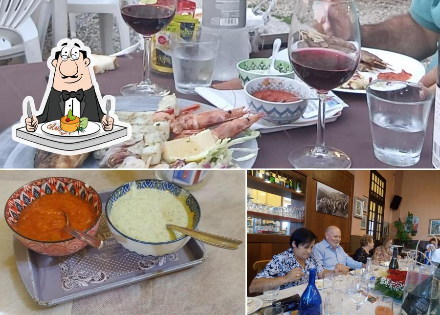 La immagine di cibo e bancone da bar da Pizzeria U Carugiu