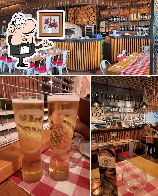 Take a look at the photo depicting interior and beer at Cucina Unica