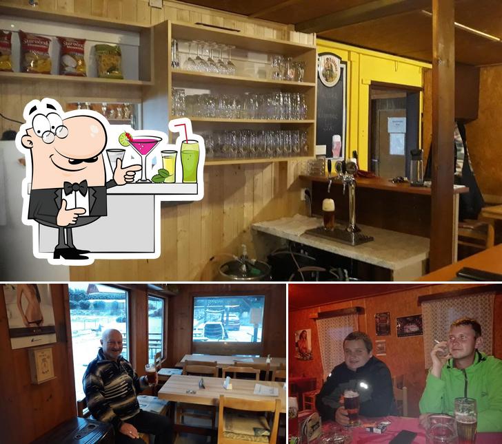 Check out the image showing bar counter and interior at Hospoda na hřišti