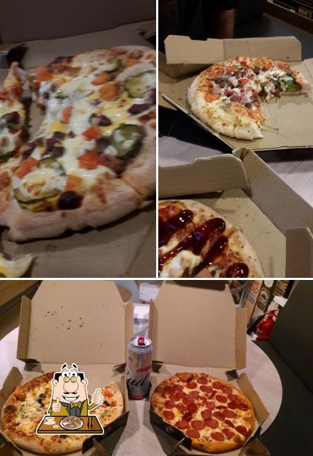 Try out pizza at Domino Pizza