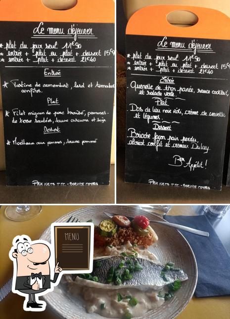 Check out the photo depicting blackboard and food at La Table De Louis