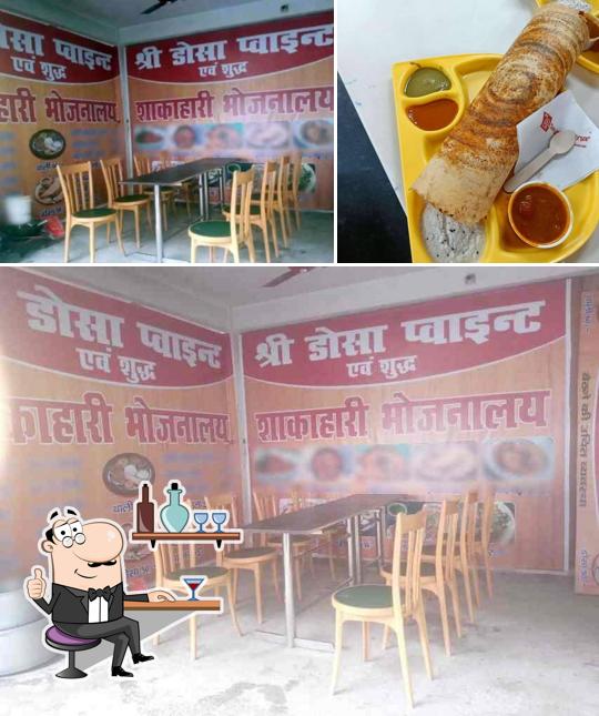 Take a look at the image depicting interior and food at Shri Dosa Point