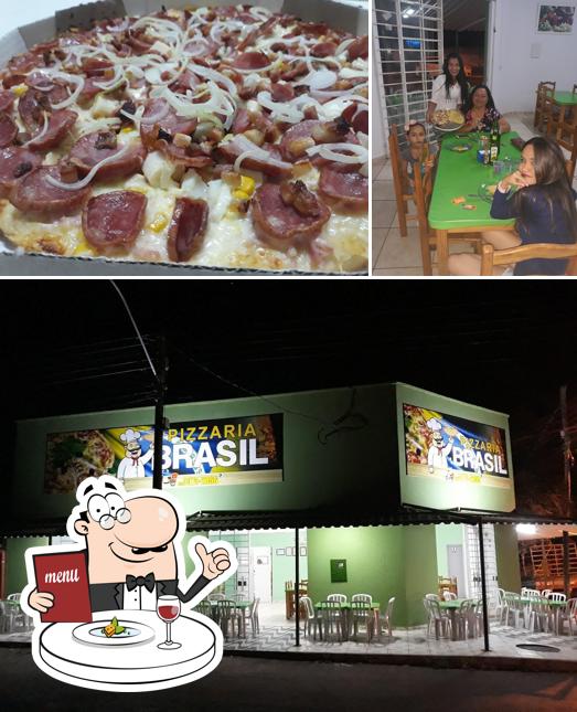 Esta é a foto apresentando comida e mesa de jantar no Pizzaria Brasil