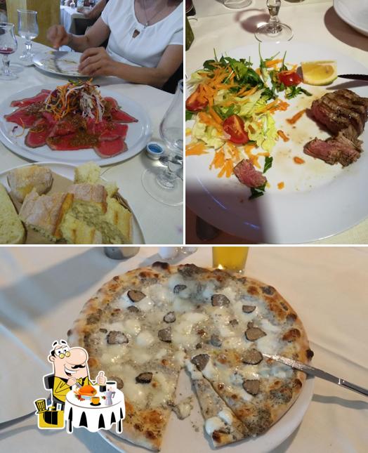 Questa è la immagine che presenta la cibo e tavolo da pranzo di Agropizza snc - Ristorante Pizzeria Dal Re