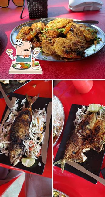 Take a look at the photo displaying food and interior at Fish Neck