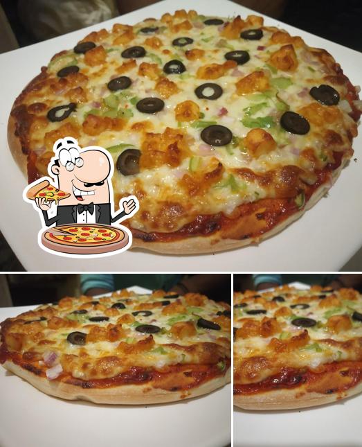 Get pizza at Shree Cafe