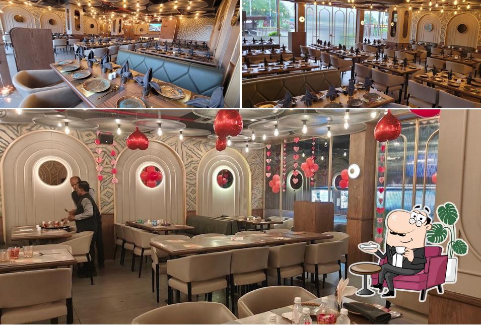 Take a seat at one of the tables at Thakkars Bawarchi Restaurant