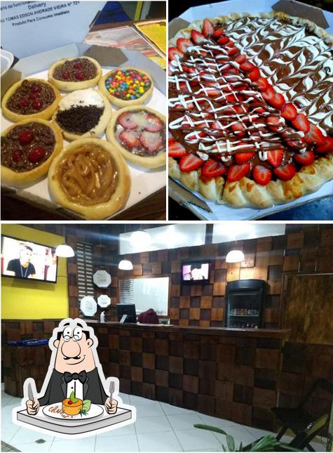 Entre diferentes coisas, comida e interior podem ser encontrados no ELOHIM ESFIHARIA E PIZZARIA