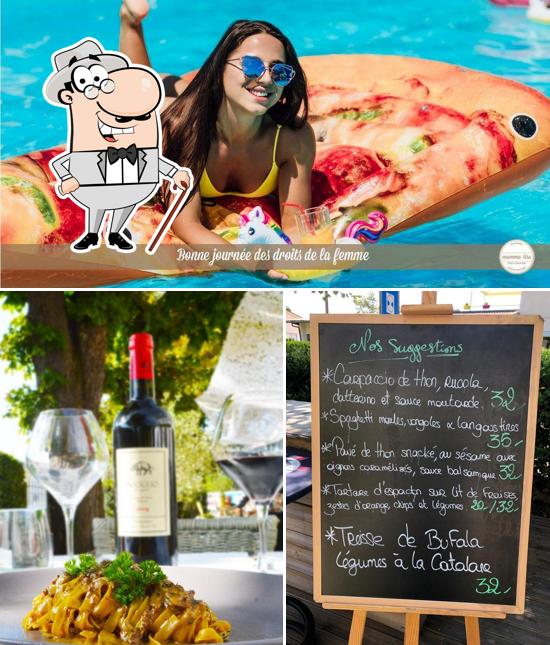 Dai un’occhiata alla immagine che presenta la esterno e lavagna di Mamma Lisa Pizzeria