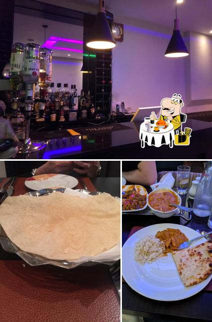 Взгляните на это фото, где видны еда и барная стойка в Rasal Restaurant
