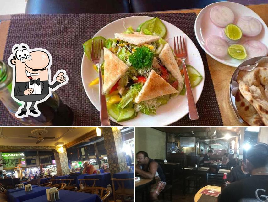 Take a look at the image displaying interior and food at Carvalho's Bar & Restaurant