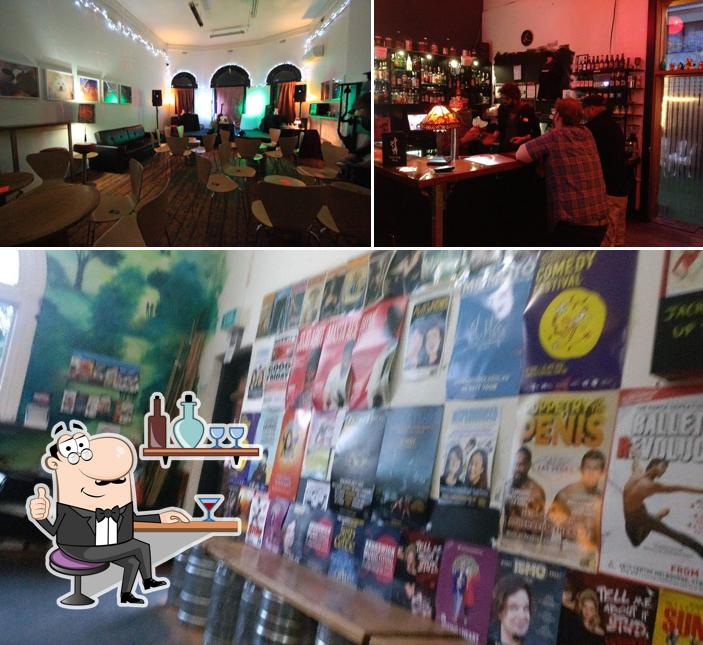 Check out the image displaying interior and food at Dancing Dog Cafe