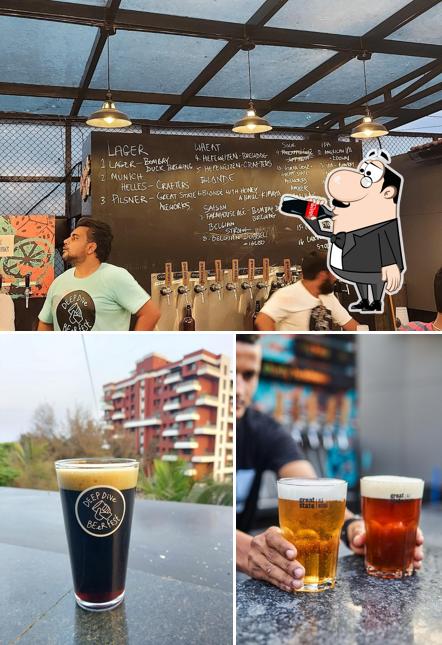 Among different things one can find drink and blackboard at Great State Dive