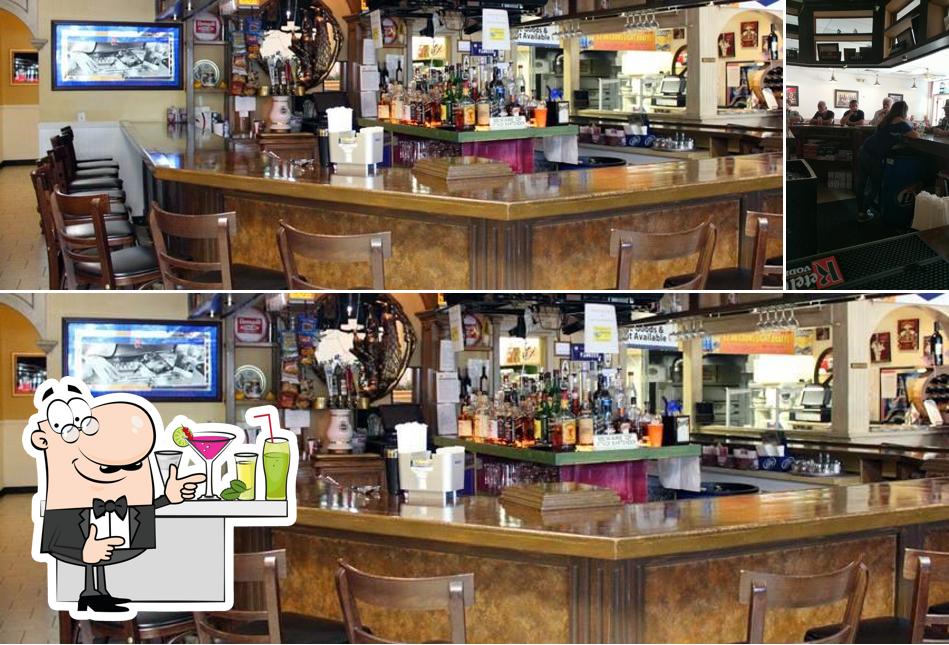 The photo of bar counter and interior at Vito's Pizza & Pub