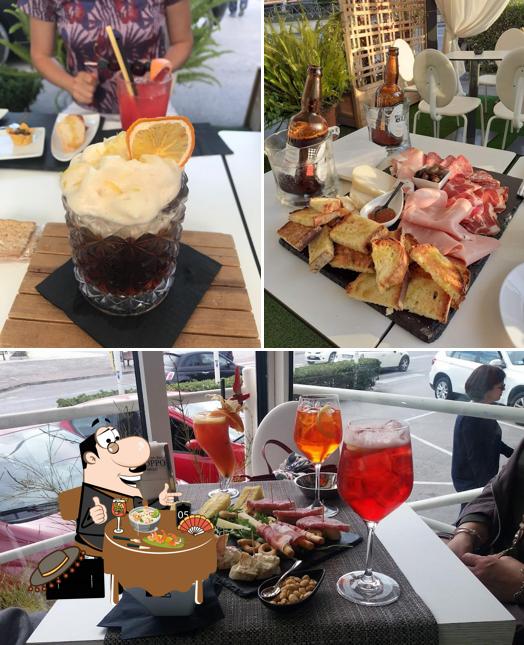 Dai un’occhiata alla foto che presenta la cibo e tavolo da pranzo di American Bar Coppo