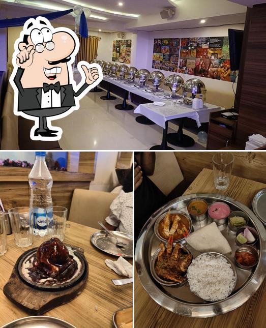 Take a seat at one of the tables at Ratnagiri Malvani Non Veg Restaurant Mira Road