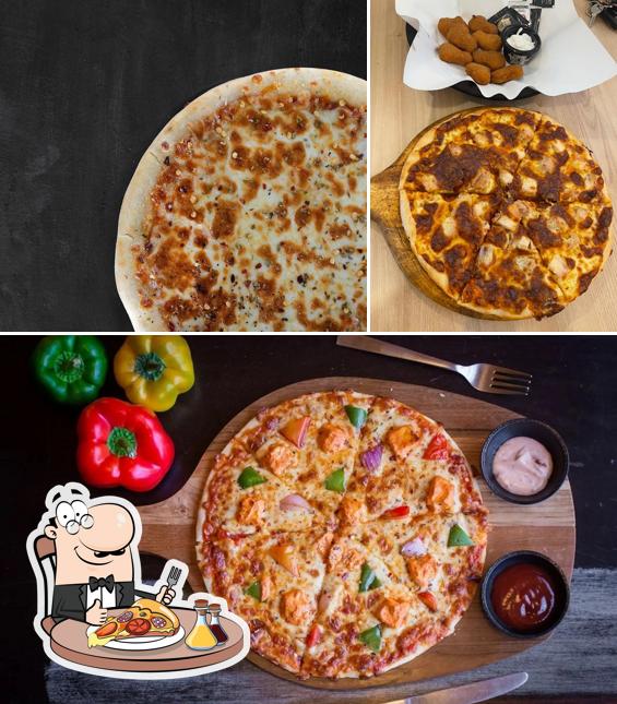 Get pizza at Food Bite - Pure Veg