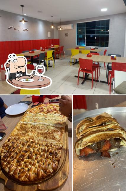 Confira a foto mostrando comida e interior no Hummm! Pizzas - Rancho Novo