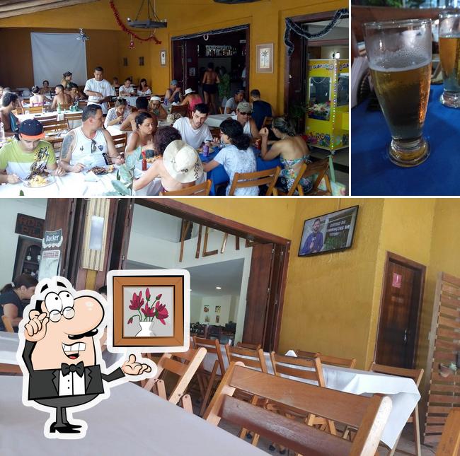 A imagem a Canecão Restaurante e Pizzaria’s interior e cerveja