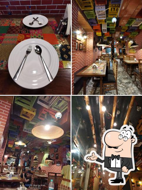 Take a seat at one of the tables at Oye Balle Balle Dhaba