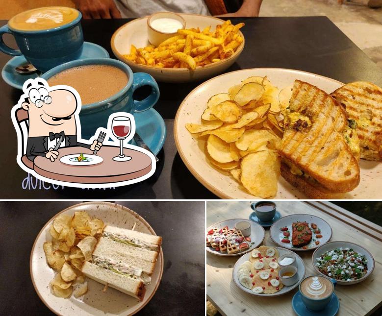 Among various things one can find food and dining table at Blue Tokai Coffee Roasters Saket