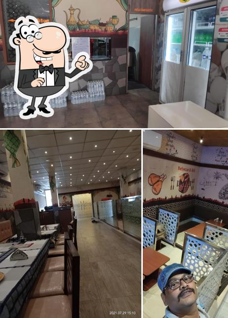 Take a seat at one of the tables at Zamzam family restaurant