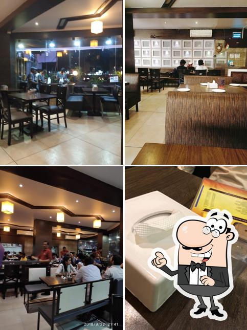 Take a seat at one of the tables at Mao The Family Restaurant