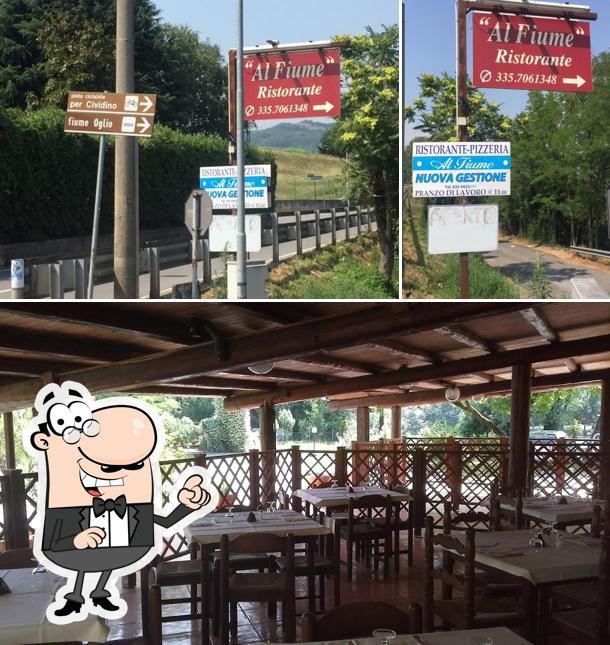 Dai un’occhiata alla immagine che presenta la esterno e tavolo da pranzo di La Locanda al Fiume