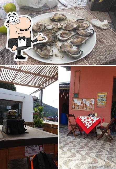 A foto do Divina Gula Restaurante’s interior e frutos do mar